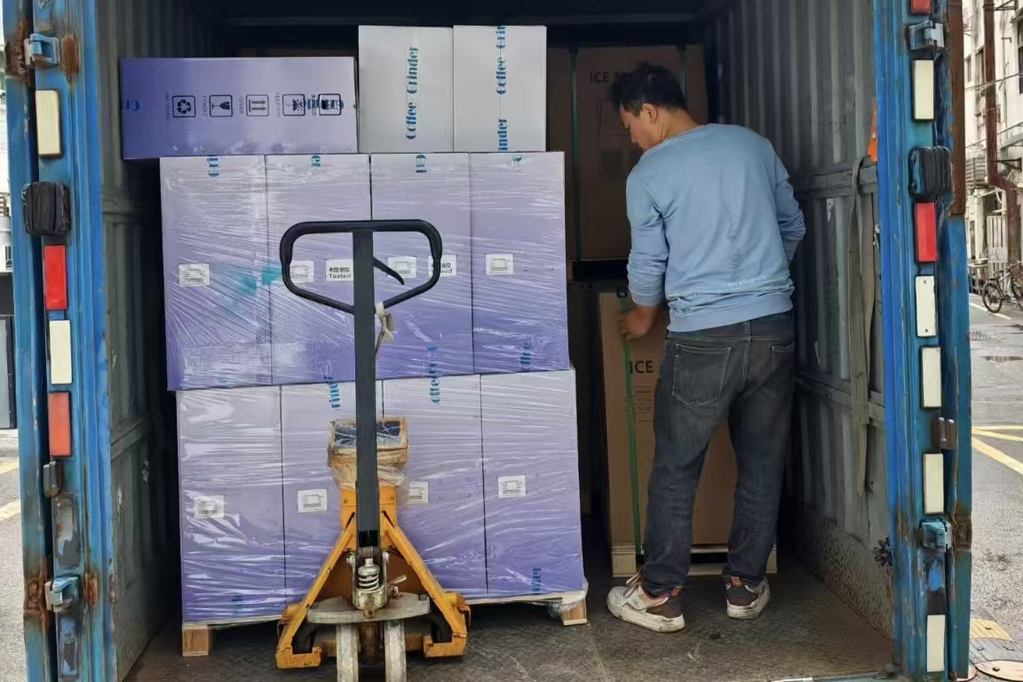 Pallet with espresso machines and barista accessories including knock box and milk jugs