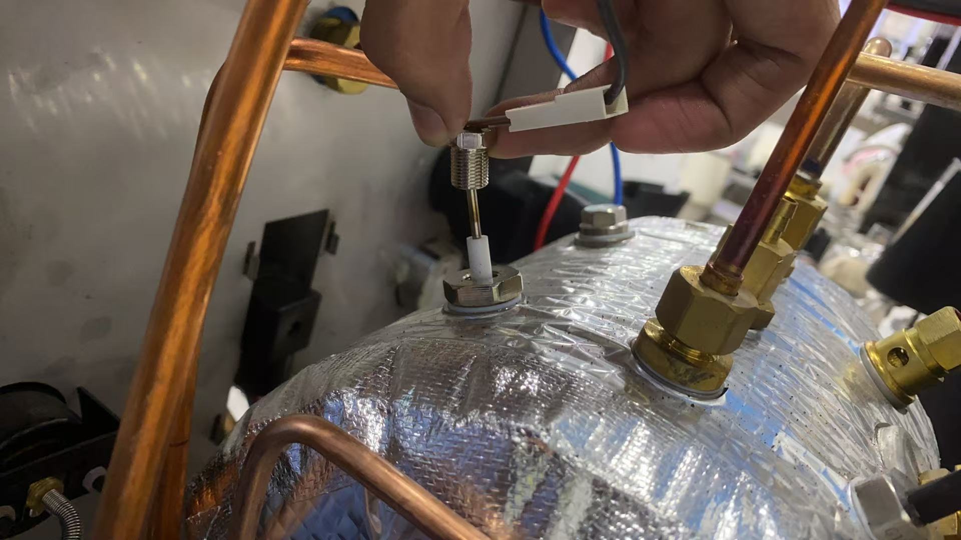 Coffee equipment distributor on video conference call with supplier for remote technical support to troubleshoot client's espresso machine